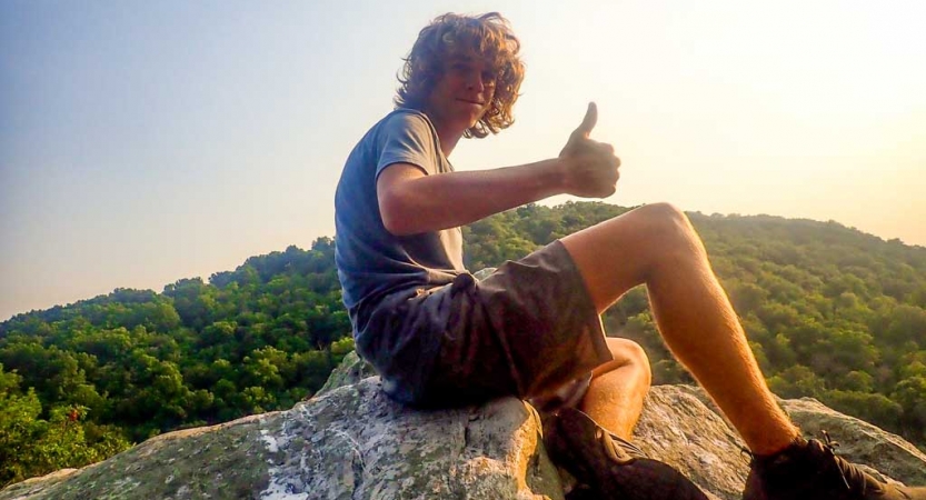 a student gives a thumbs up sign on a wilderness program for teens in baltimore